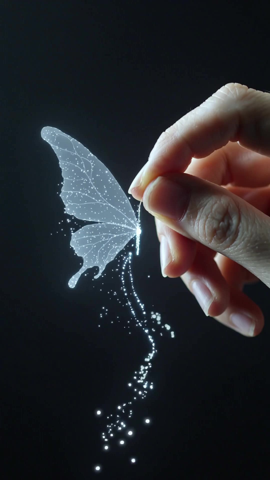 艺术家手指绘制发光蝴蝶翅膀，星光粒子魔法氛围| AI Video